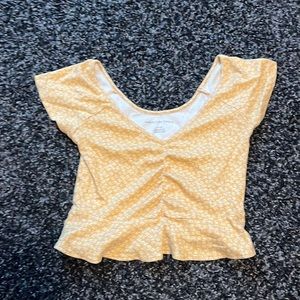 American eagle white and yellow floral shirt